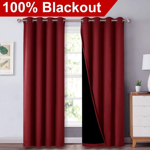 Burgundy blackout curtains with silver grommet top, one panel showing black thermal lining for 100% light blocking.