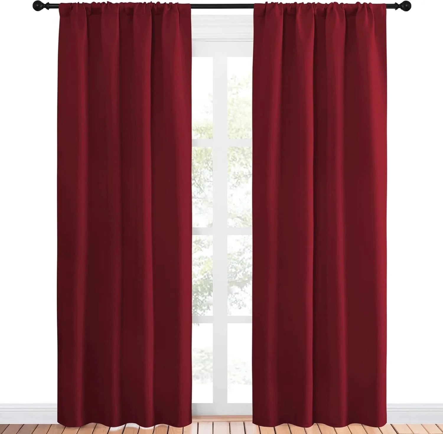 Burgundy blackout rod pocket curtains on a black rod in a window
