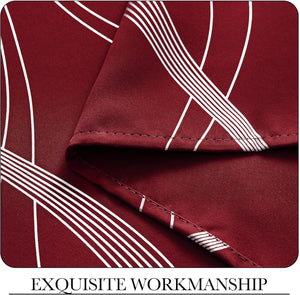 Close-up of rich burgundy fabric featuring a white abstract geometric line pattern and visible, neat stitching.