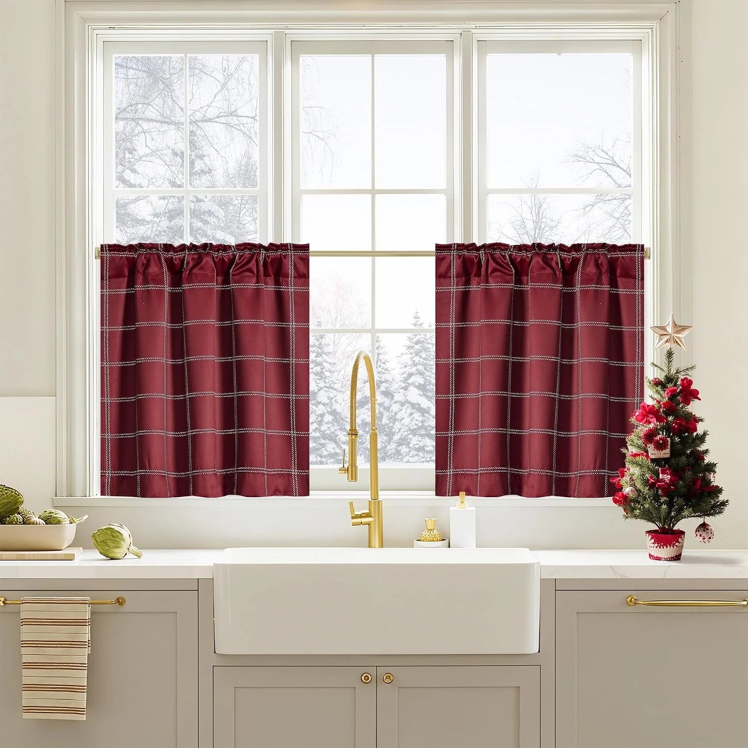 Burgundy plaid tier curtains over a bright farmhouse kitchen sink window
