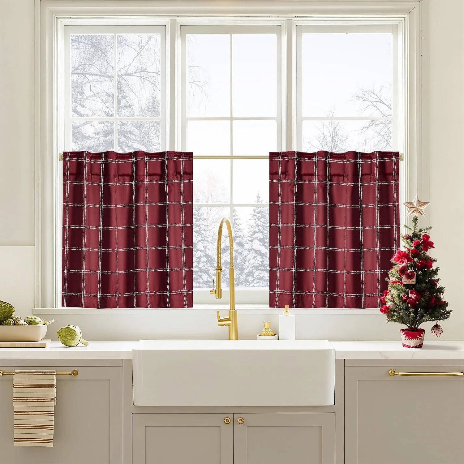 Burgundy plaid tier curtains over a bright farmhouse kitchen sink window