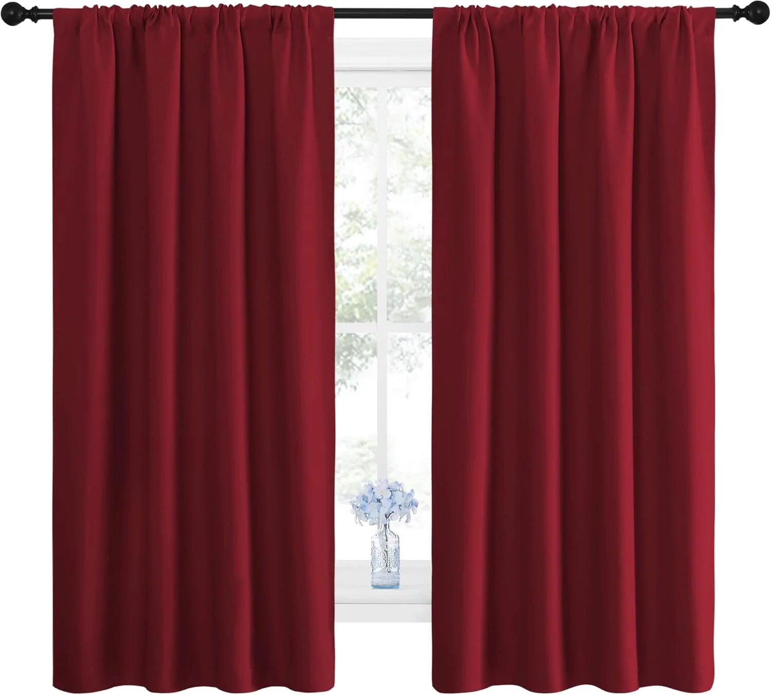 Pair of rich burgundy red rod pocket blackout curtains in a window setting
