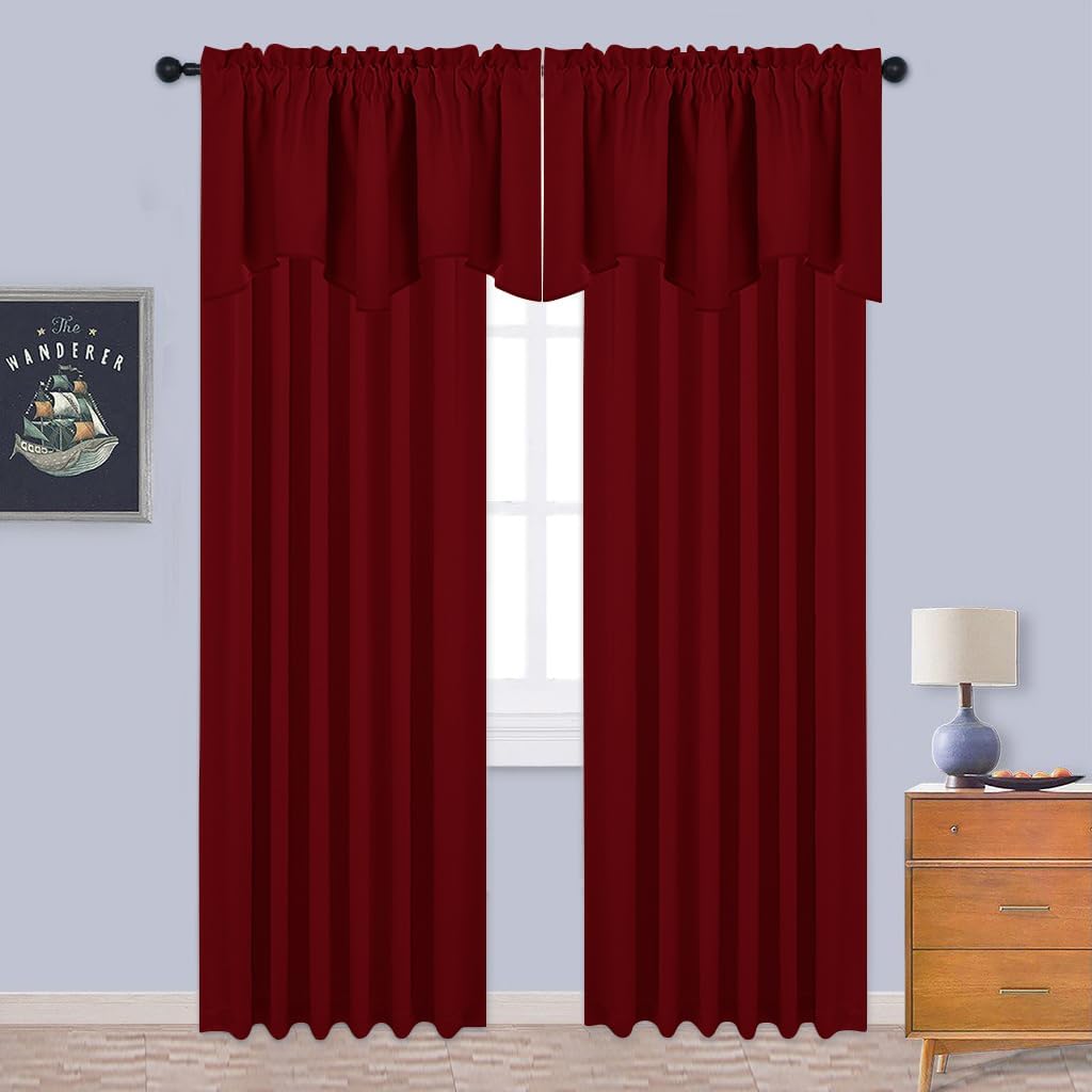 Burgundy rod pocket blackout curtains with attached scalloped valance covering a window.