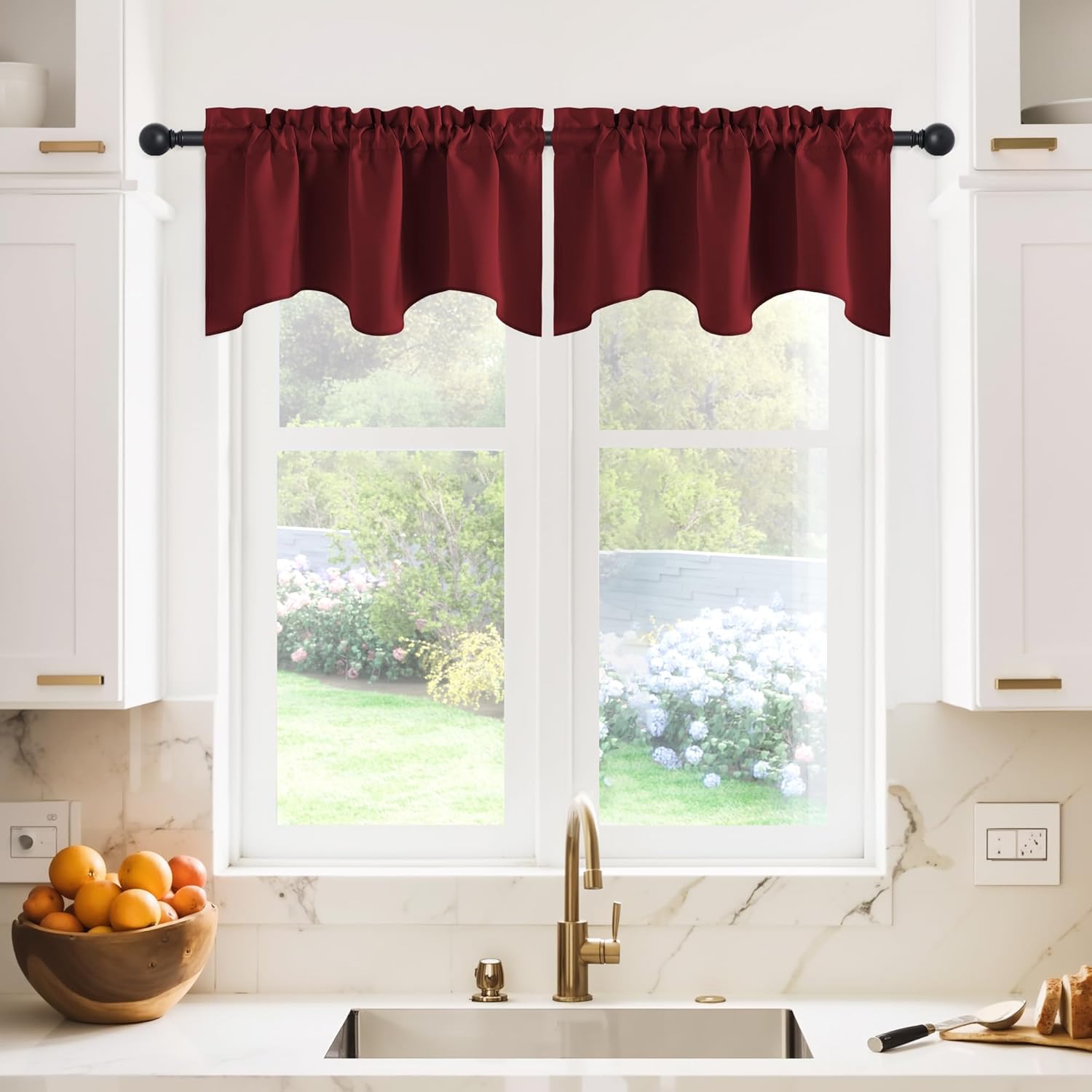 Burgundy ruffled rod pocket valance with a scalloped bottom edge over a bright kitchen window.