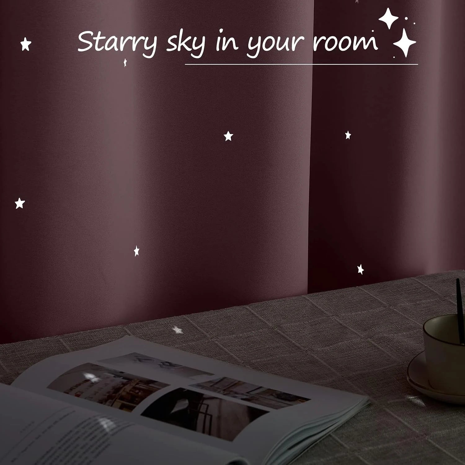 Burgundy wall with glowing star decals above a table with book and cup