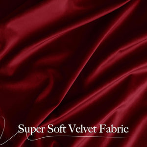 Luxurious burgundy super soft velvet fabric draped elegantly, highlighting its rich color and plush texture.