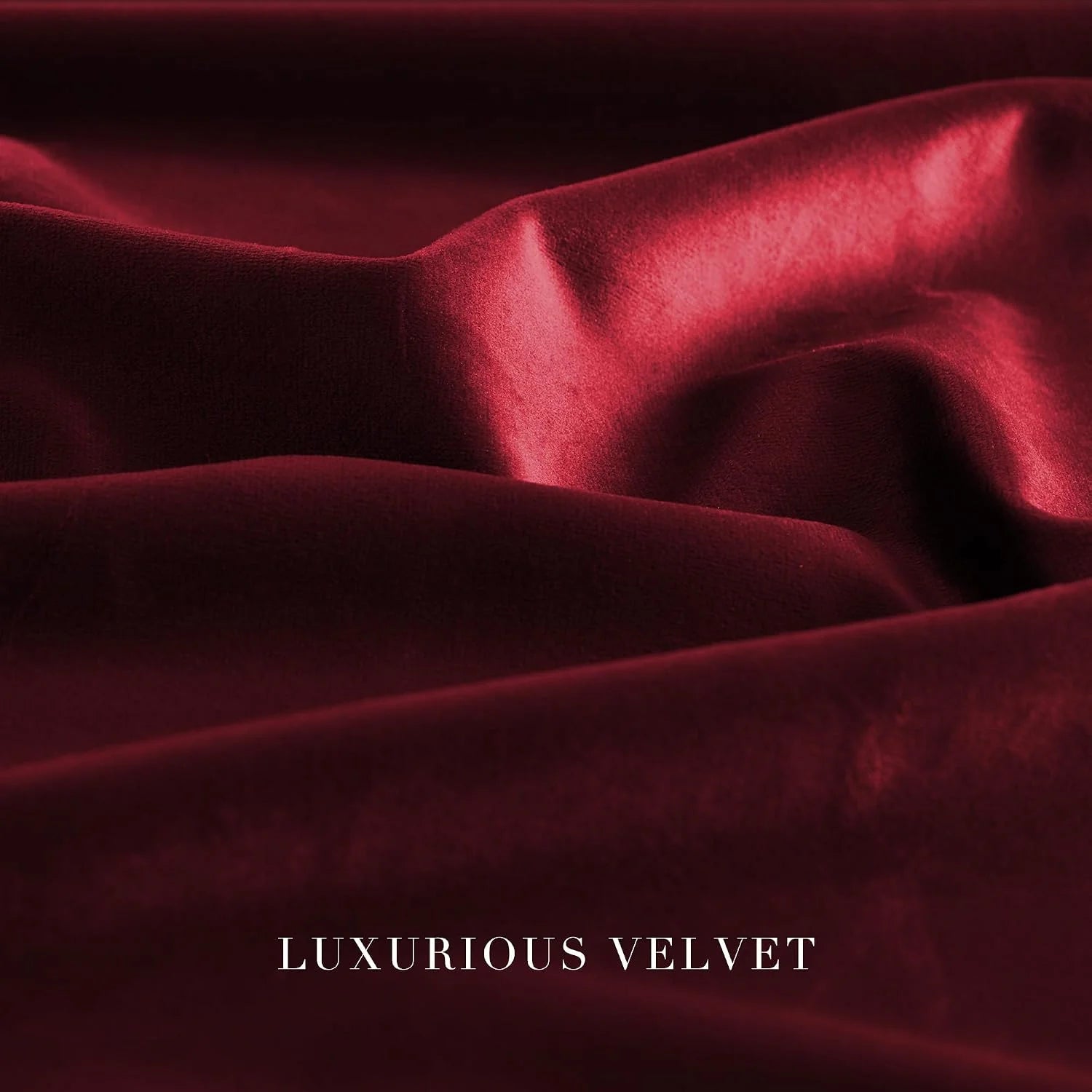 Close-up of rich burgundy velvet fabric with soft folds and a lustrous sheen