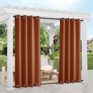 Burnt orange outdoor grommet curtains on a white pergola, perfect for patio privacy.
