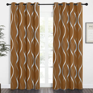 A pair of burnt orange curtains with silver wavy patterns and grommet tops hanging on a black rod.