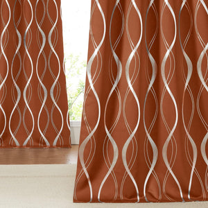 Burnt orange drapes with a modern silver abstract wavy line pattern, providing room darkening and privacy.