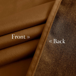 Smooth camel brown fabric front and dark textured blackout material on the reverse side.