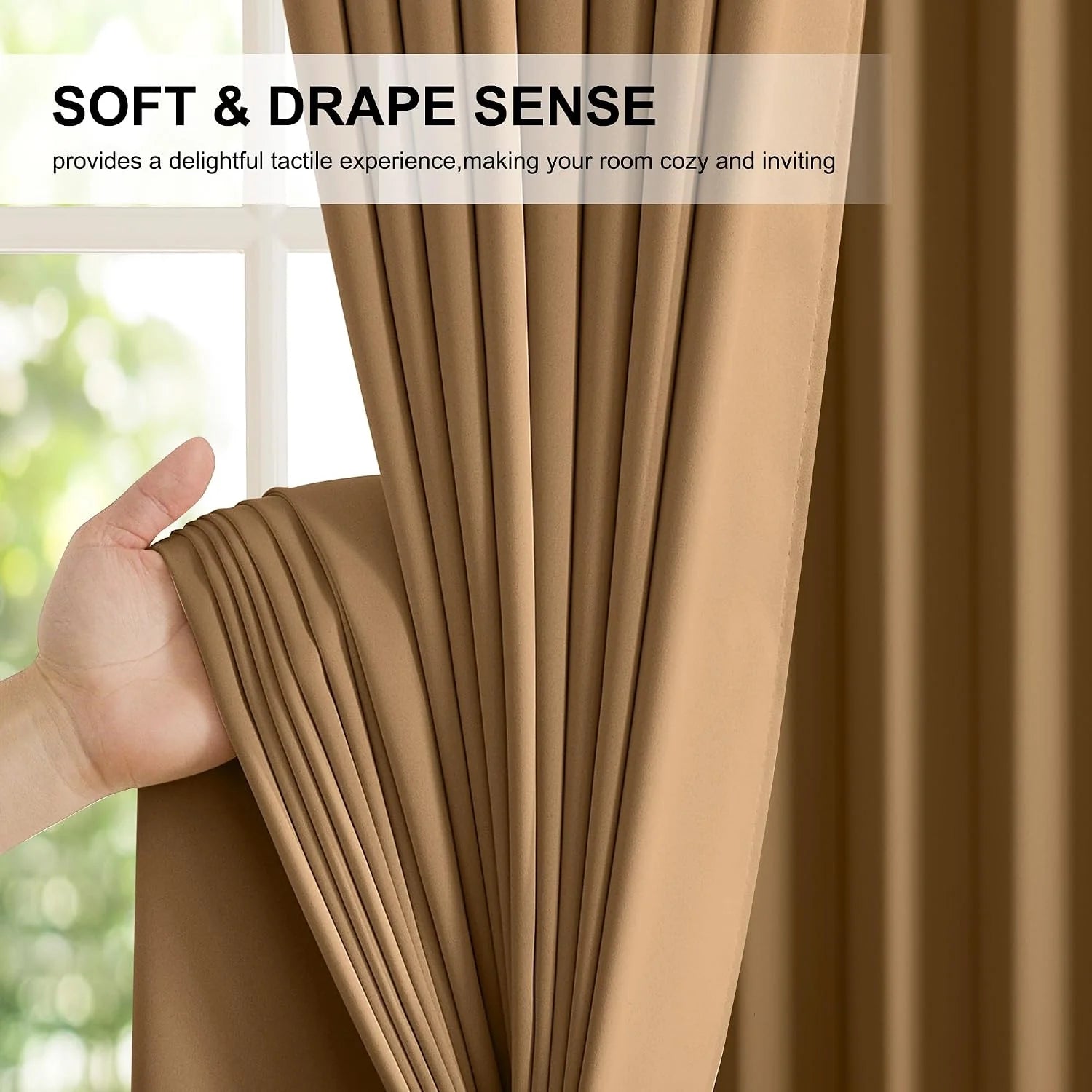 Hand holding soft camel curtain fabric with elegant pleats beside a bright window