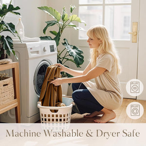 Soft caramel brown textured throw blanket being loaded into a washing machine.