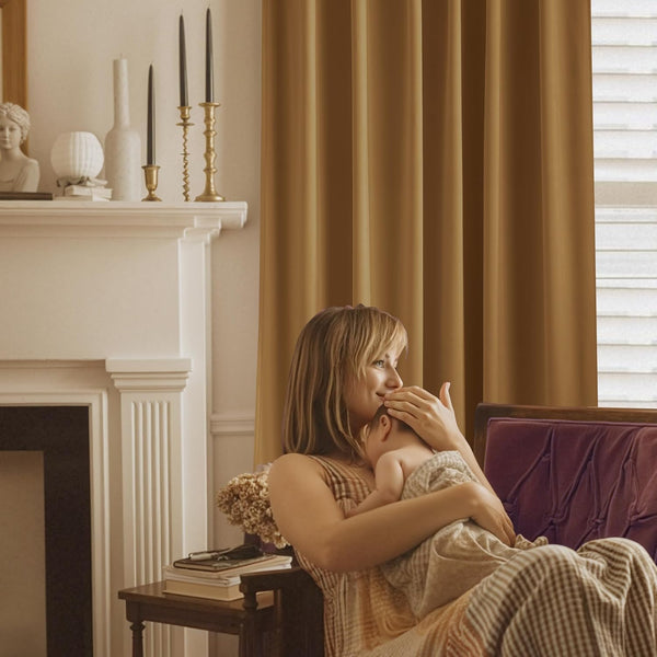 Caramel brown solid blackout curtains with a smooth drape in a comfortable, softly lit living room.