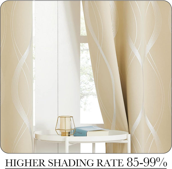 Elegant champagne beige blackout curtains with abstract silver wavy patterns covering a window.