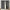 Charcoal gray blackout curtains with rod pocket top, one curtain open revealing dark lining.
