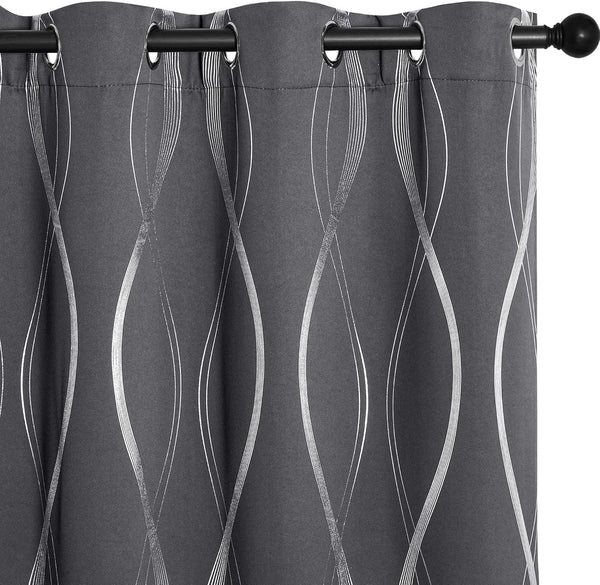 Charcoal gray curtain panel with metallic silver wavy lines, grommet top on a black rod.