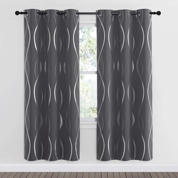 Modern charcoal gray curtains with shimmering silver foil wave patterns and grommet tops, framing a window.