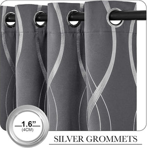 Close-up of dark gray curtains featuring a white wavy stripe pattern and 1.6-inch silver grommets.