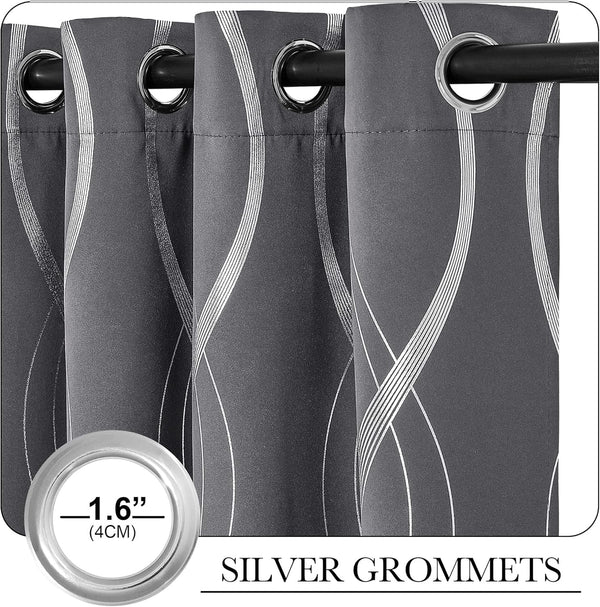 Charcoal gray curtains with abstract white wavy pattern and silver grommet top, hanging on a rod.