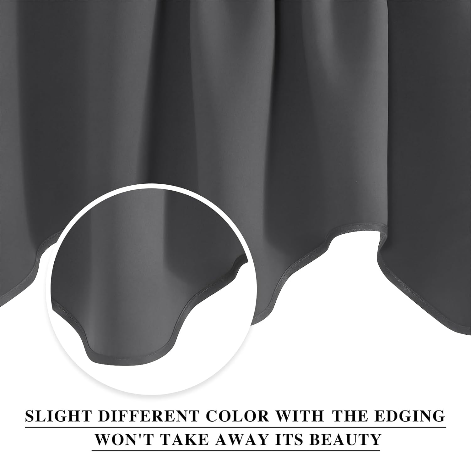 Close-up of charcoal grey blackout curtain fabric with smooth texture and a neatly sewn bottom hem