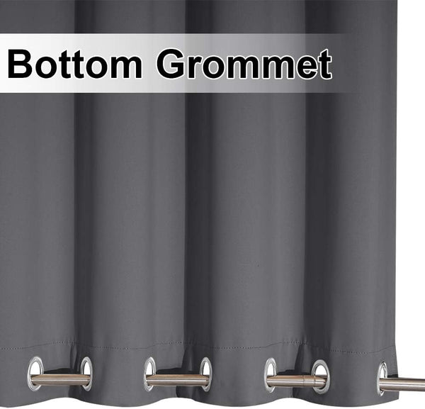 Close-up of a charcoal grey curtain panel showing several silver-toned grommets along its bottom hem.