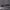 Close-up of charcoal grey woven fabric showing a clean flat seam with even stitching along the folded edge.