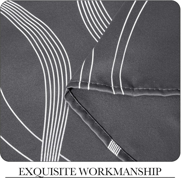 Close-up of smooth charcoal grey fabric with modern white curved stripe pattern and neat stitching.