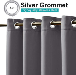 Close-up of charcoal grey curtains featuring silver 1.6-inch stainless steel grommets on a gold rod.
