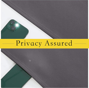 Charcoal grey textured fabric demonstrating full privacy by obscuring a bright smartphone's flash.