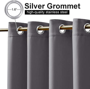 Charcoal grey curtains with visible 1.6-inch silver stainless steel grommets, hanging on a gold rod.