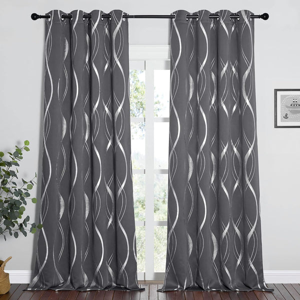 Charcoal grey grommet curtains with continuous shimmering silver wave pattern, hanging by a window.