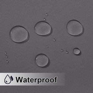 Close-up of charcoal grey fabric with clear water droplets beading on the surface, demonstrating waterproofing.