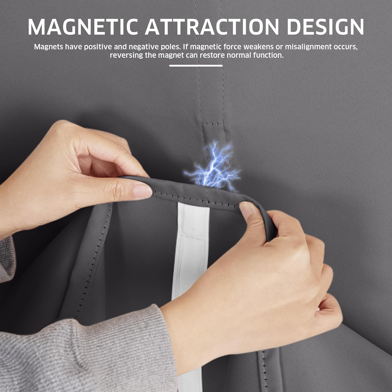 Person's hands revealing the magnetic closure design of a charcoal grey blackout curtain panel.
