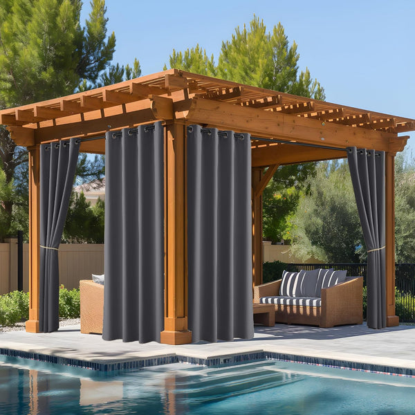 Charcoal outdoor grommet curtains on a wooden pergola by pool, offering shade to patio seating.