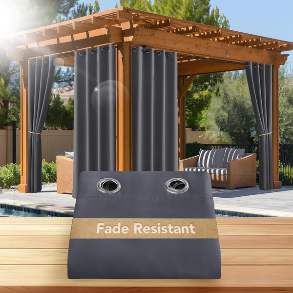 Charcoal gray fade resistant outdoor curtains with grommets hanging on a poolside pergola.