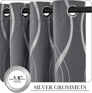 Close-up of dark gray curtains with a silver wavy pattern and 1.6-inch silver grommets.