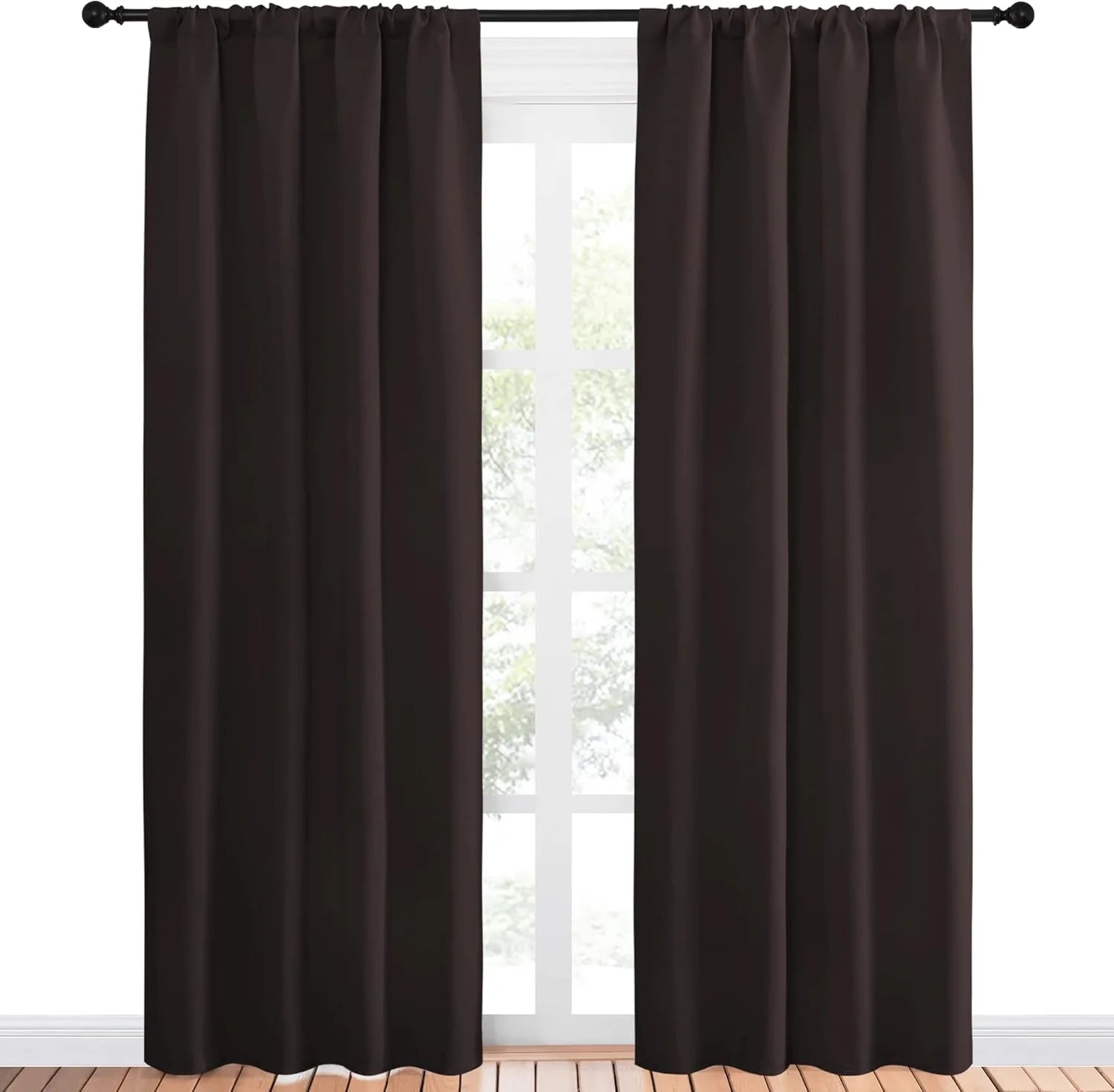 Dark chocolate brown blackout curtains with rod pocket top on a black rod.