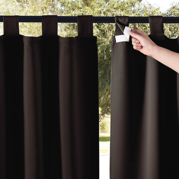 Dark brown outdoor tab top curtain, a hand shows the hook and loop closure on one tab.
