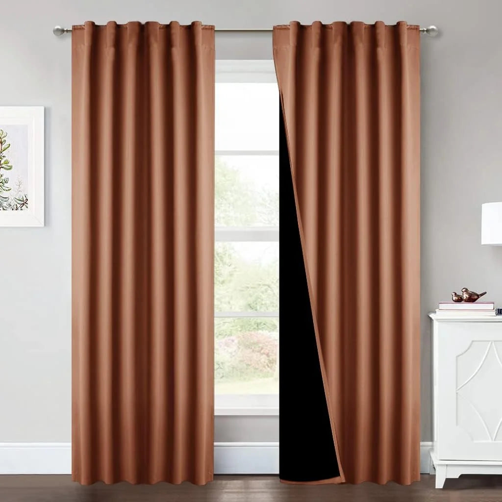 Copper brown blackout curtains with rod pocket top hanging in a bright modern room
