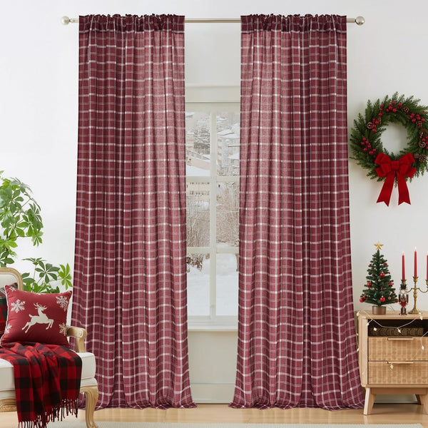 Cranberry red window curtains with white plaid pattern, rod pocket top, hanging on a silver rod.
