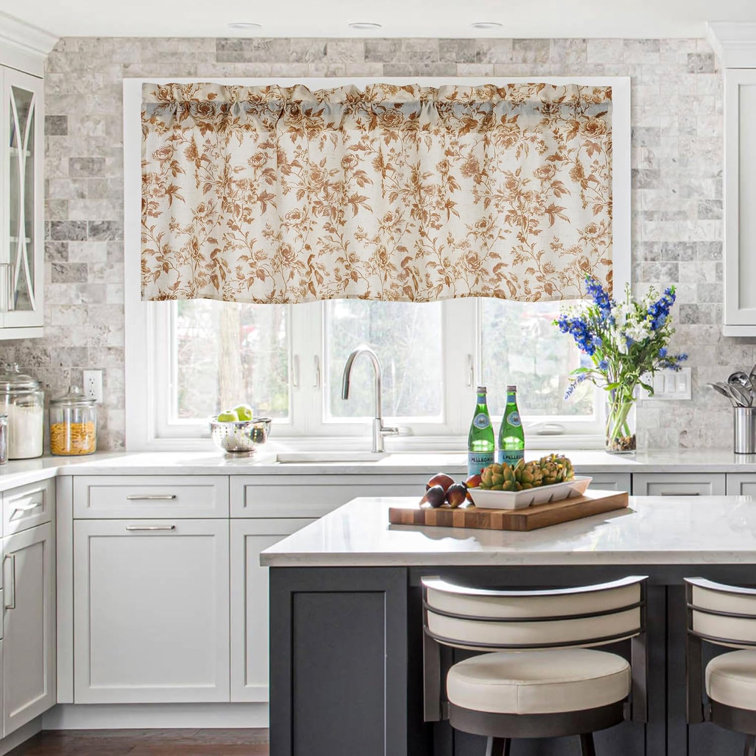 Ruffled cream window valance featuring a brown floral rose pattern, adorning a kitchen window.