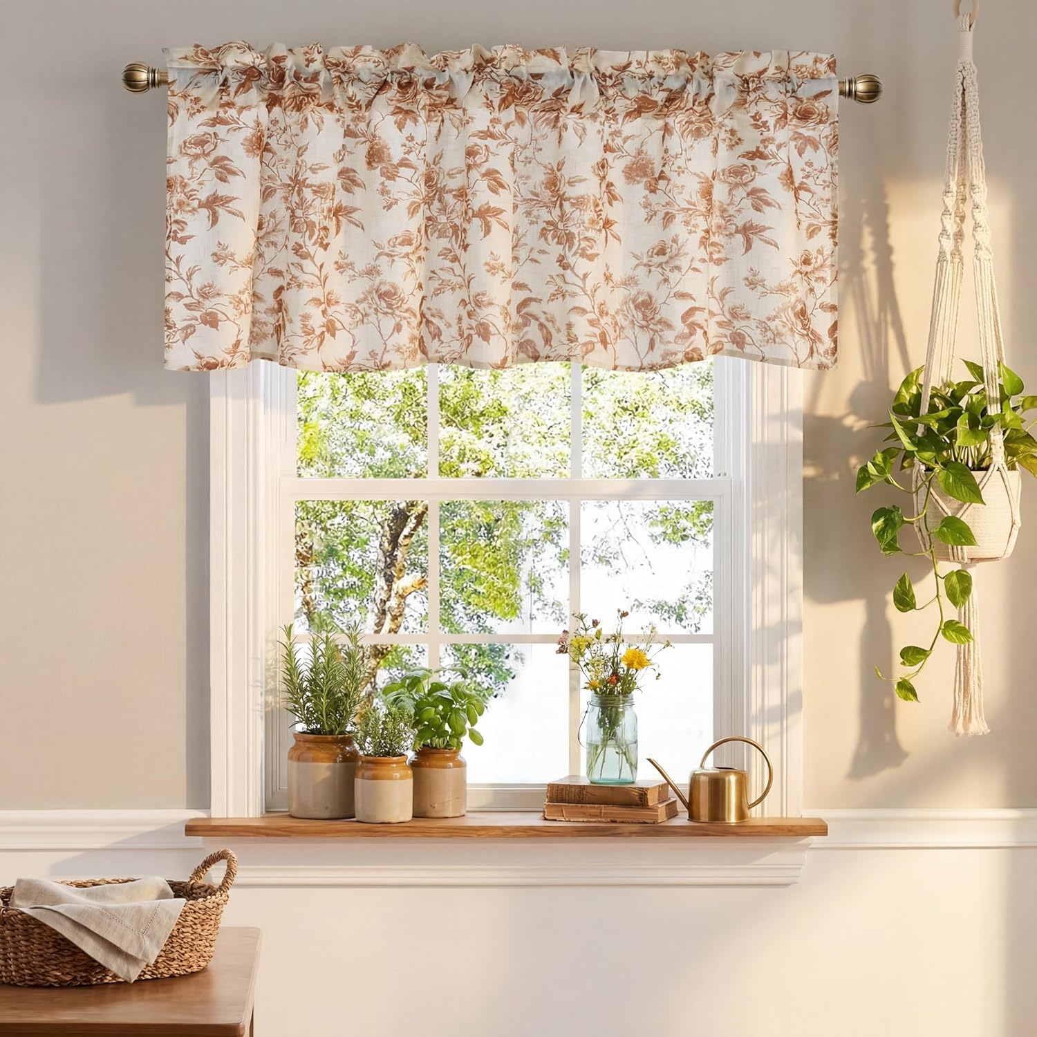 Cream and brown floral window valance with ruffled top, hanging over a sunlit kitchen window.