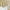 Cream window valance with shimmering gold floral branches, rod pocket top, and a curved hem.