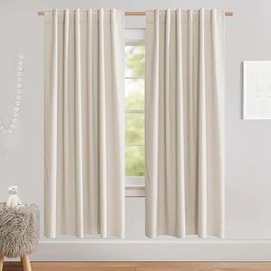 Natural cream linen blend curtains with a back tab top, hanging on a light wood rod over a window.