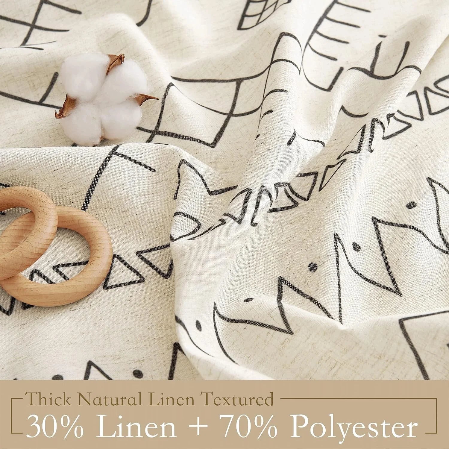 Cream linen blend fabric with black geometric print, shown in a textured close-up