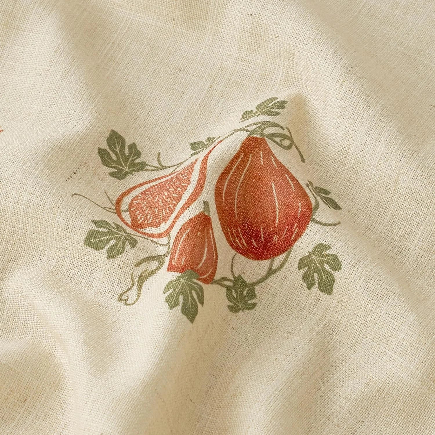 Cream linen fabric with rust fig botanical print and soft green leaves