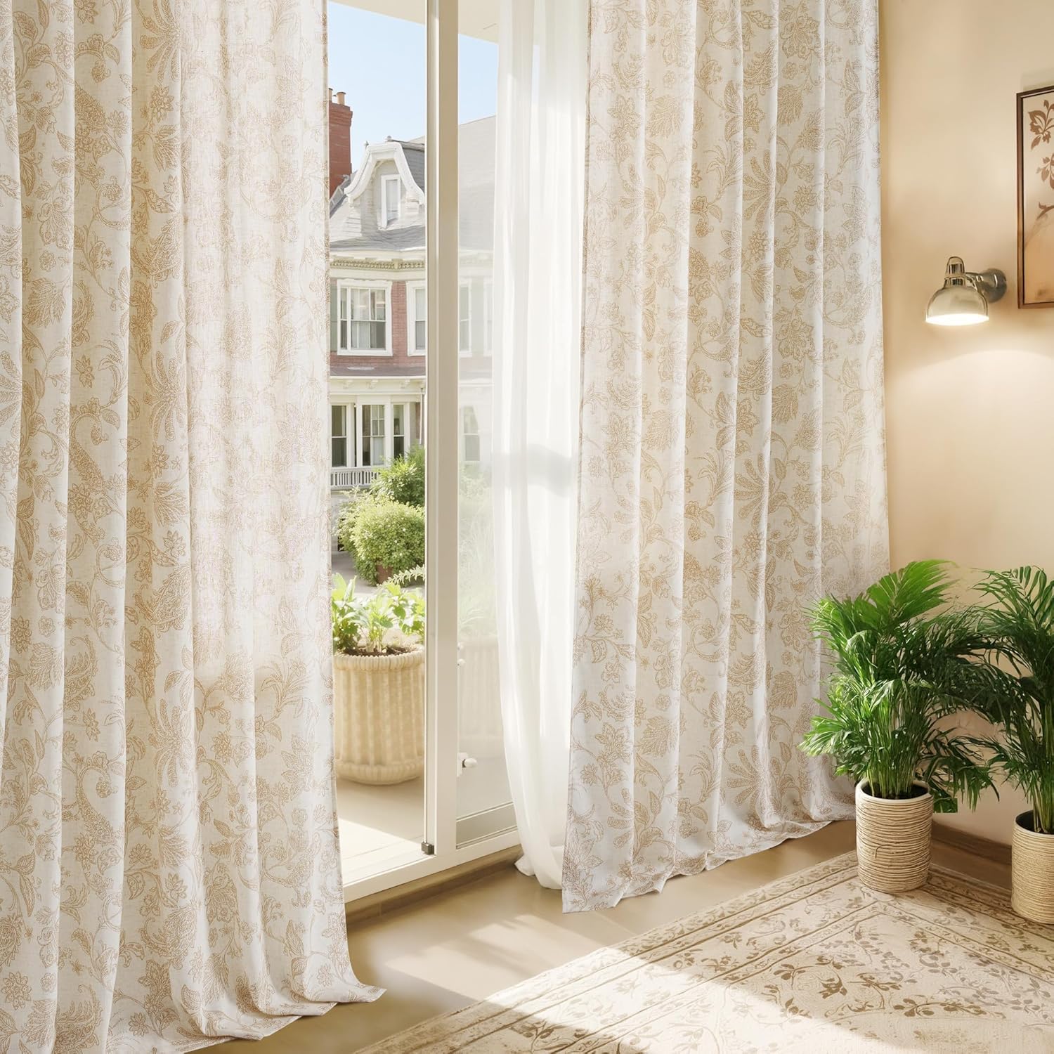 Cream linen curtains with a subtle light brown floral paisley print, enhancing a bright room with a balcony view.
