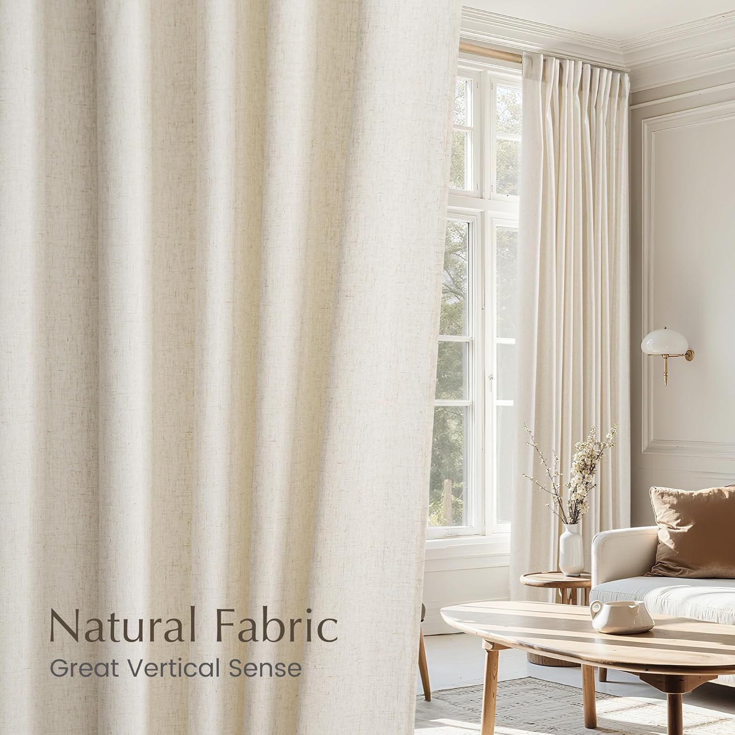 Elegant cream natural fabric pinch pleat curtains with textured weave in a bright, modern living room.