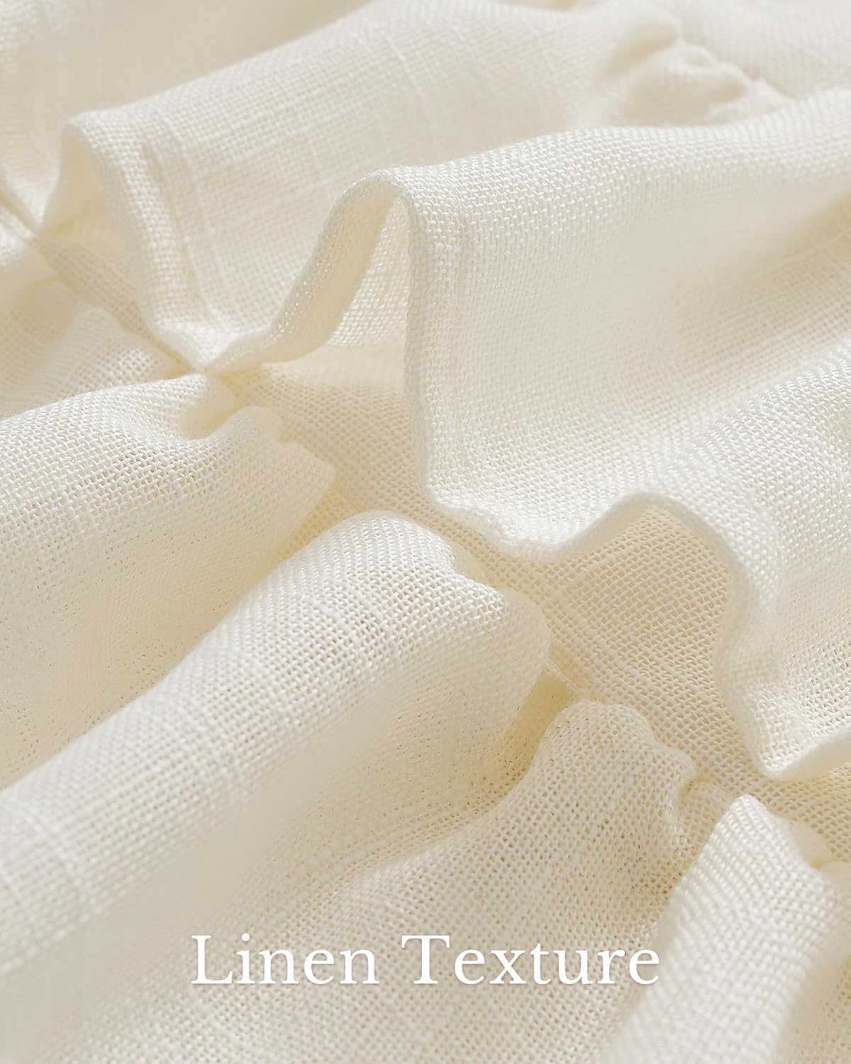 Textured close-up of light cream linen fabric, folded into soft ruffles, highlighting its natural weave.